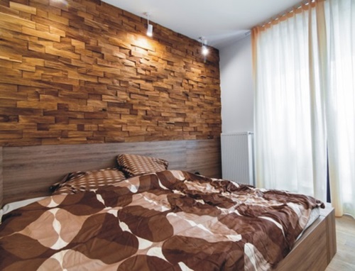 Drewniane panele na ścianę Natural Wood Panels wykorzystane w sypialni